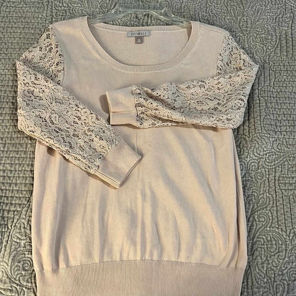 Light pink sweater with lace sleeves